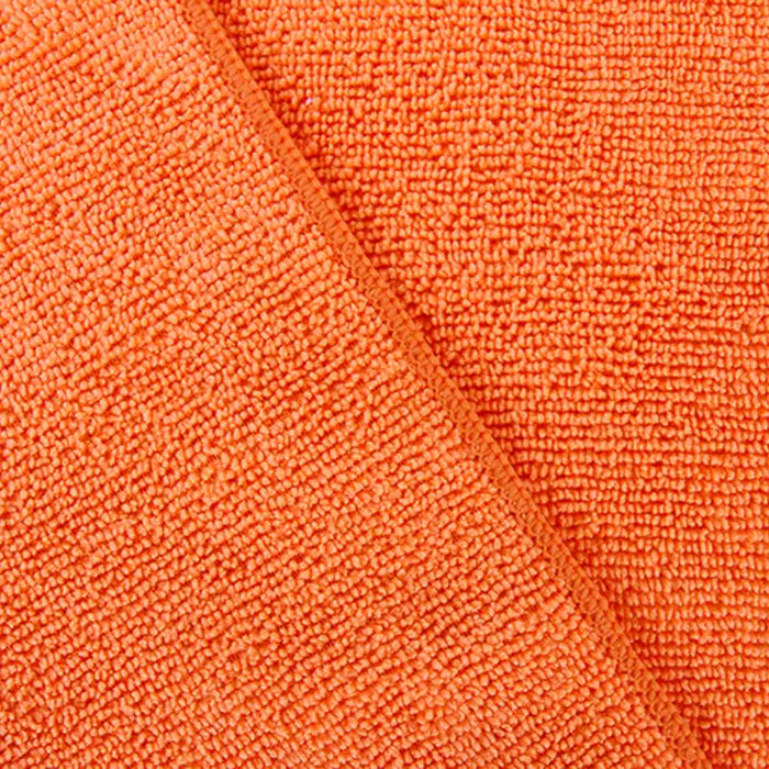 close up of orange Tricol Clean Everplush Commercial Grade 16 inch Microfiber Cleaning Cloth