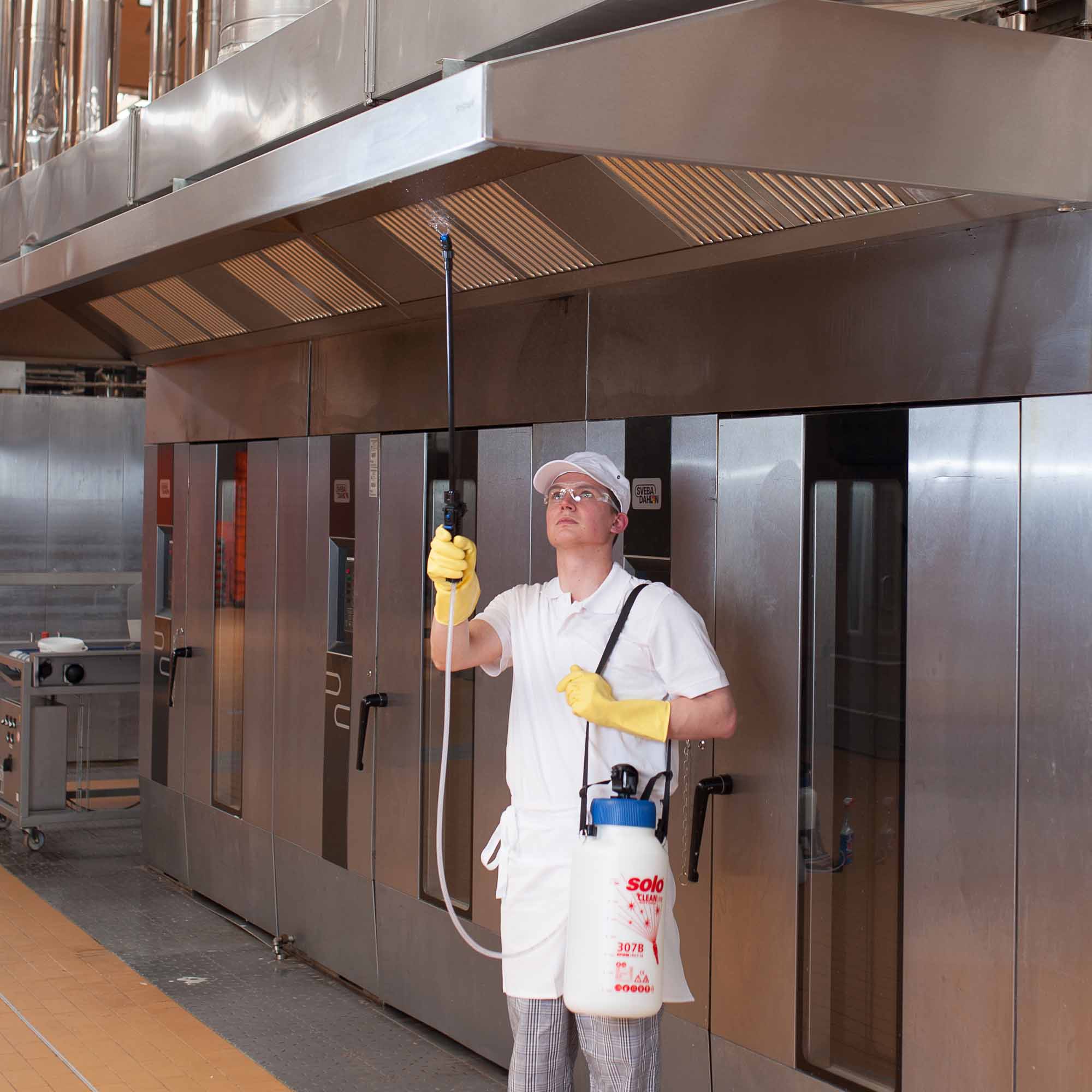 action shot of SOLO Handheld Pump Sprayer - 307-B - CLEANLine- EPDM - Alkaline - 2 GAL